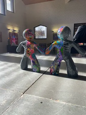 Sculptures Ni-Zu ( My sculptural series, Ni-Žu, features stylized human figures joined by hidden magnets in their hands — a symbol of biomagnetic connection and the invisible energy that links us all. One half is neutral grey — calm and balanced — the other, a vivid graffiti expression of love, peace, family, and respect.)