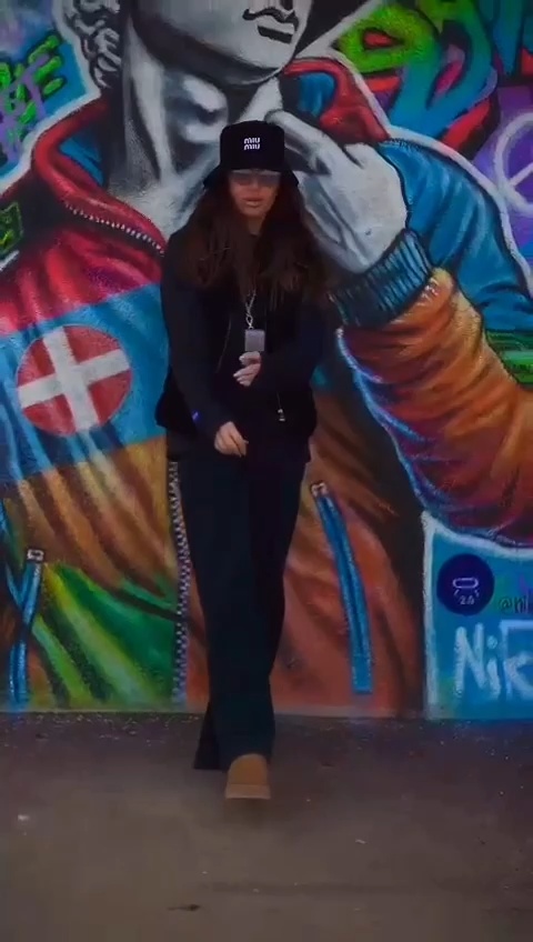 The artwork presents a striking fusion of classic and contemporary elements. At the forefront, a sculptural representation of David, renowned for his determination and strength, is transformed into a modern figure clad in ski attire. Dressed in a vibrant Nike winter jacket, the colors pop against the backdrop, creating a dynamic visual contrast that pulls the viewer in. His determined gaze is directed forward, embodying a spirit of ambition and adventure.  Behind David, the majestic Mont Blanc looms, its snow-capped peaks an awe-inspiring contrast to the figure’s playful ski attire. This juxtaposition between the grandeur of nature and the modern man in motion adds depth to the narrative of the piece.   The artwork is further enhanced by the incorporation of street art elements. Graffiti tags and urban motifs weave through the composition, lending a gritty texture and an energetic vibe that connects the classical figure to contemporary life. The overall effect is a thought-provoking blend of history and modernity, where the essence of determination is captured in the spirit of adventure.