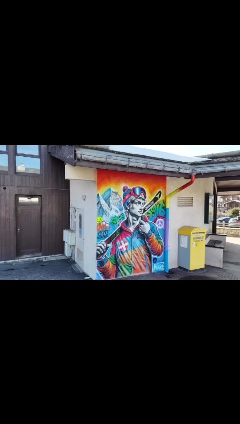 The artwork presents a striking fusion of classic and contemporary elements. At the forefront, a sculptural representation of David, renowned for his determination and strength, is transformed into a modern figure clad in ski attire. Dressed in a vibrant Nike winter jacket, the colors pop against the backdrop, creating a dynamic visual contrast that pulls the viewer in. His determined gaze is directed forward, embodying a spirit of ambition and adventure.  Behind David, the majestic Mont Blanc looms, its snow-capped peaks an awe-inspiring contrast to the figure’s playful ski attire. This juxtaposition between the grandeur of nature and the modern man in motion adds depth to the narrative of the piece.   The artwork is further enhanced by the incorporation of street art elements. Graffiti tags and urban motifs weave through the composition, lending a gritty texture and an energetic vibe that connects the classical figure to contemporary life. The overall effect is a thought-provoking blend of history and modernity, where the essence of determination is captured in the spirit of adventure.
